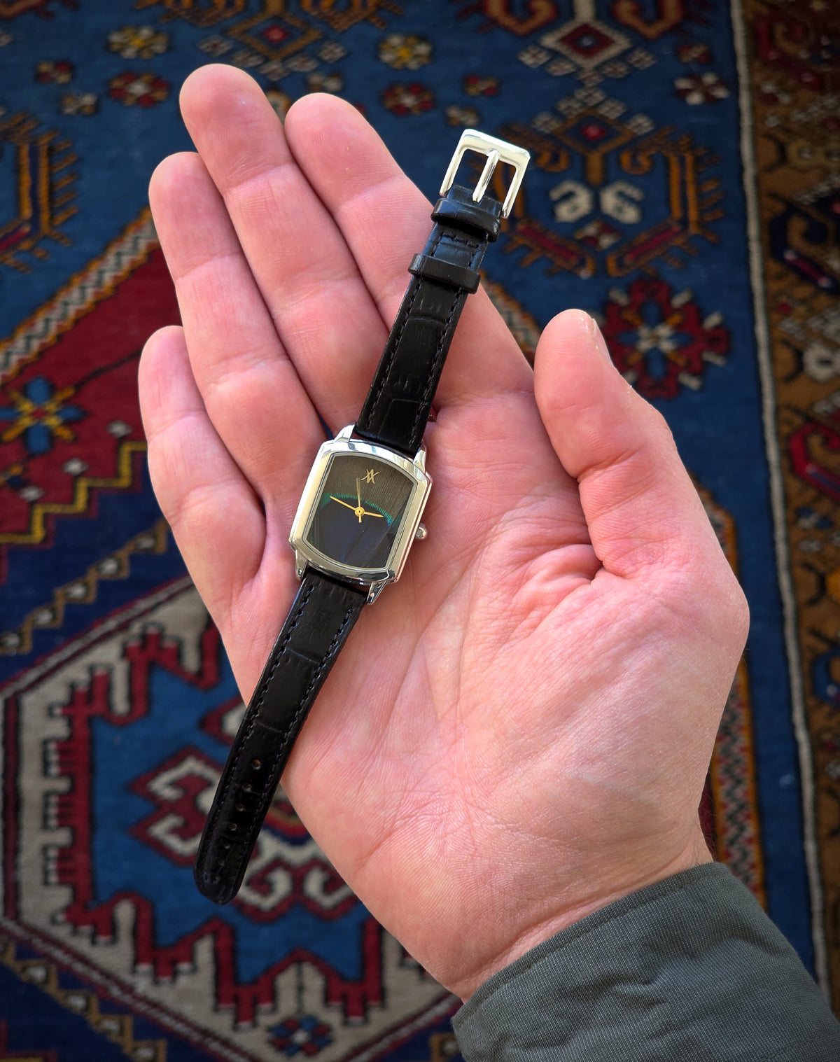 62. Peacock feather watch