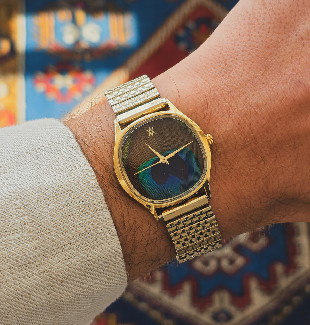 92. Peacock feather watch