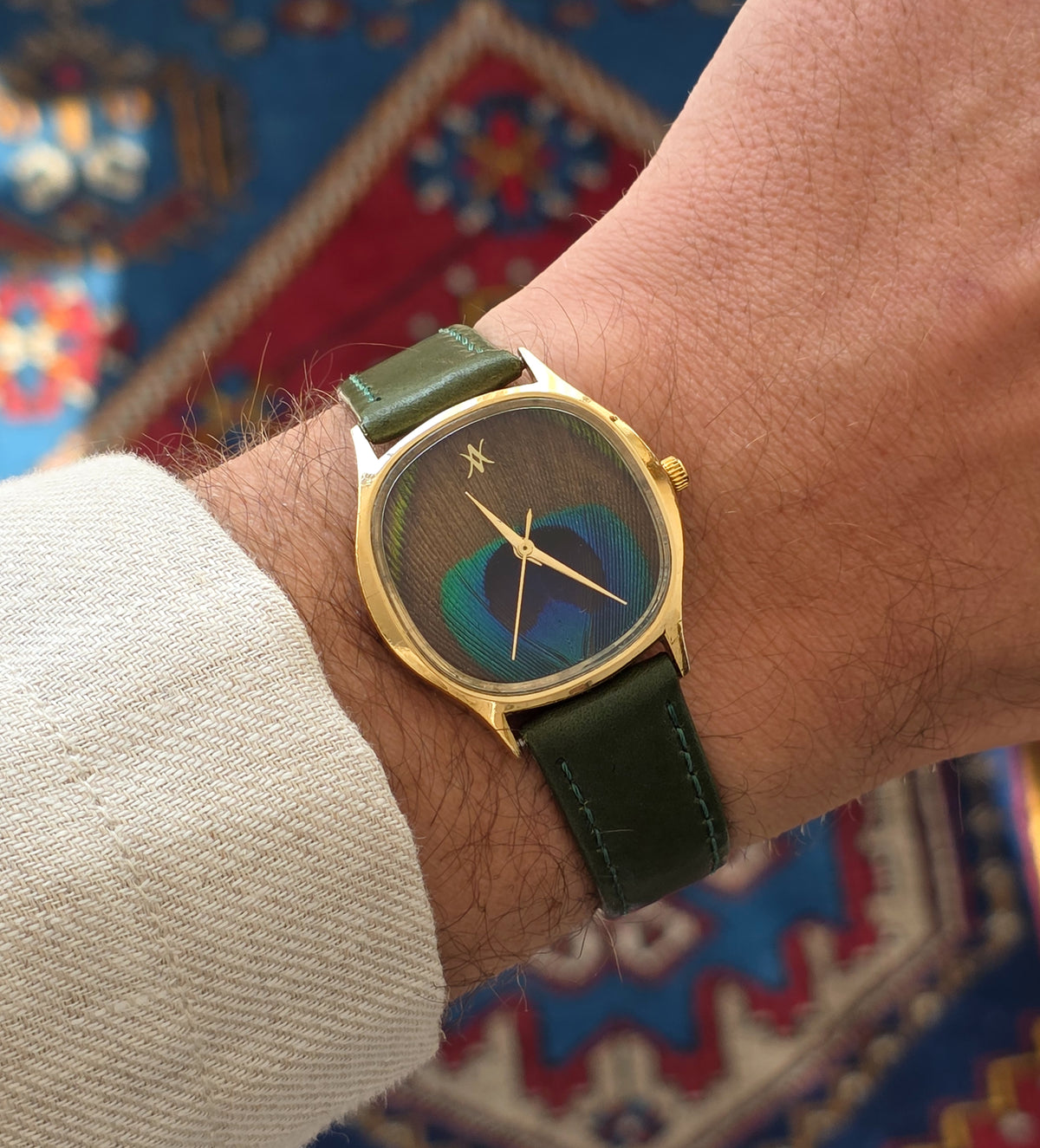 92. Peacock feather watch