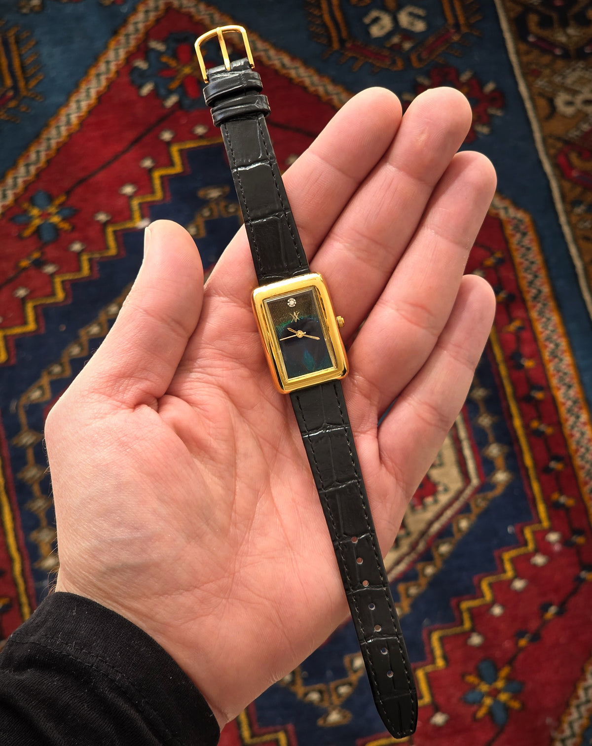 97. Peacock feather watch