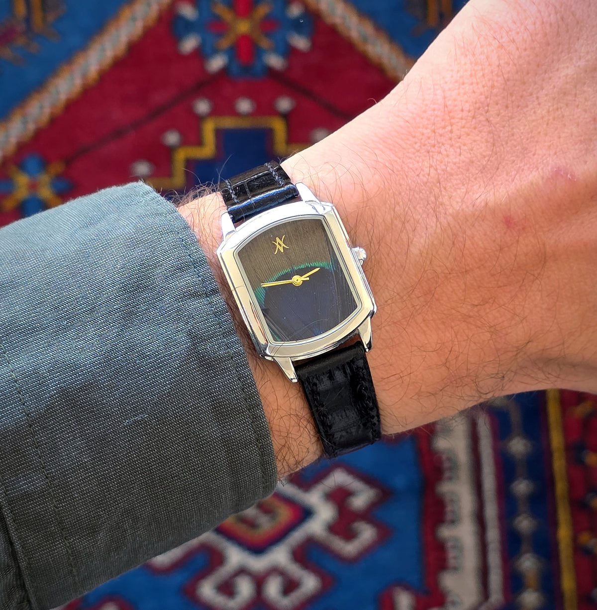 62. Peacock feather watch