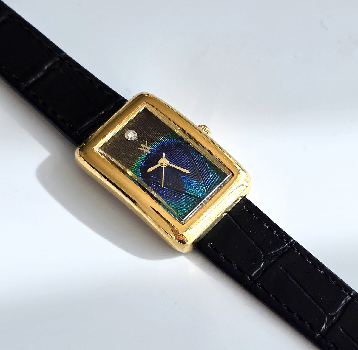 97. Peacock feather watch