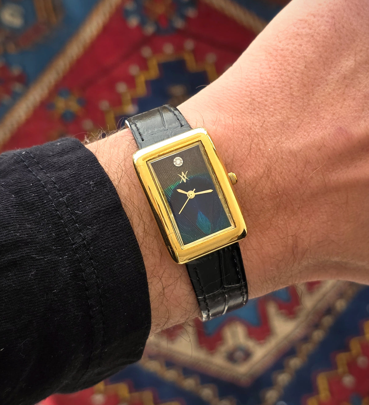 97. Peacock feather watch