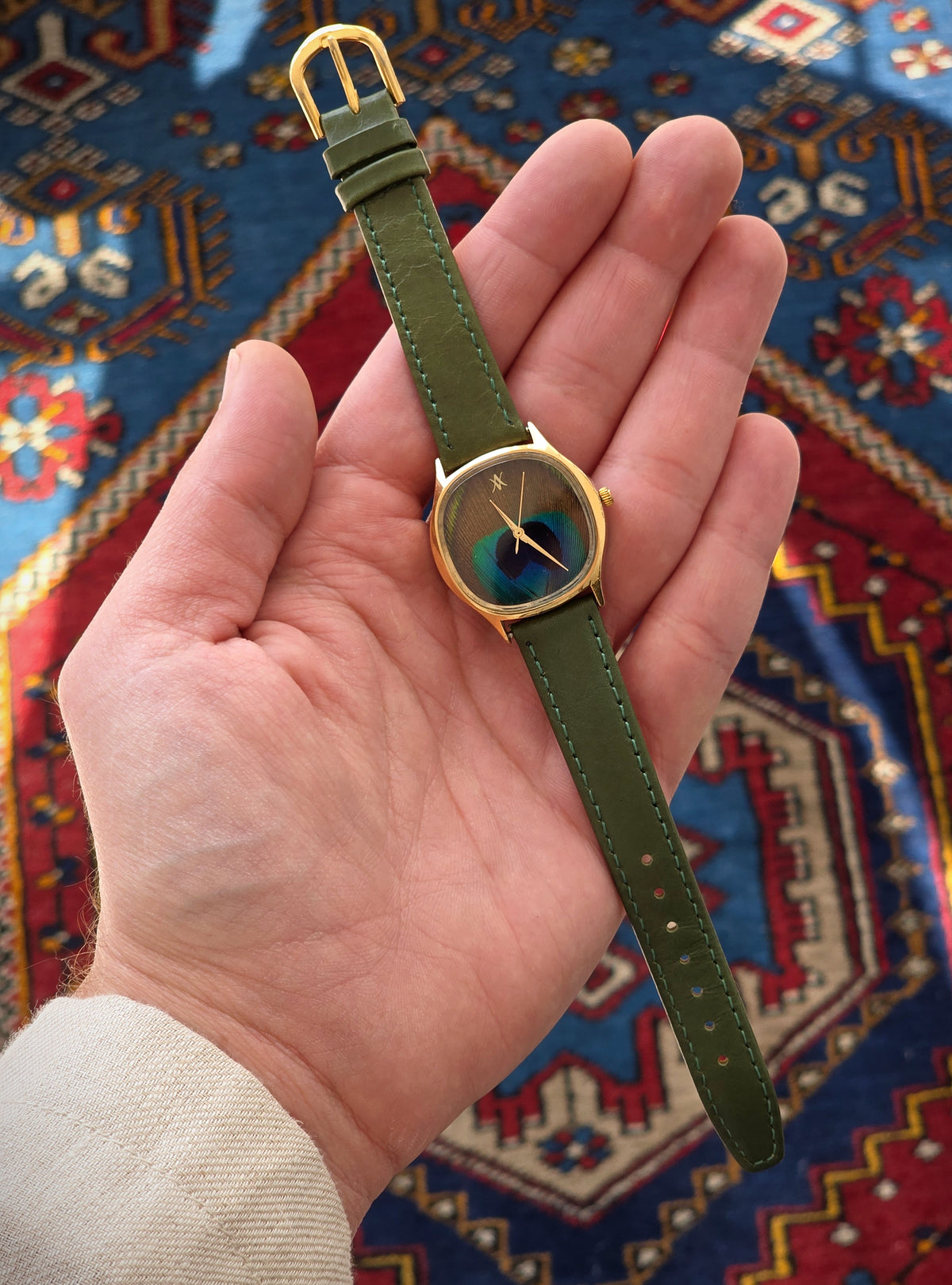 92. Peacock feather watch